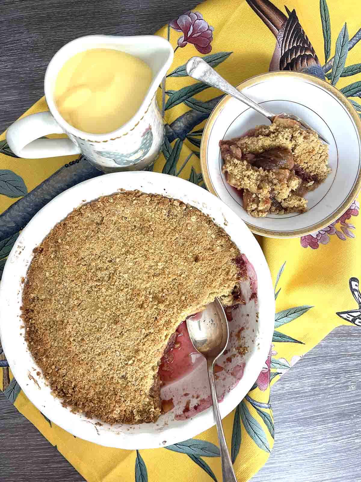 apple and fig crumble with a portion in a bowl.