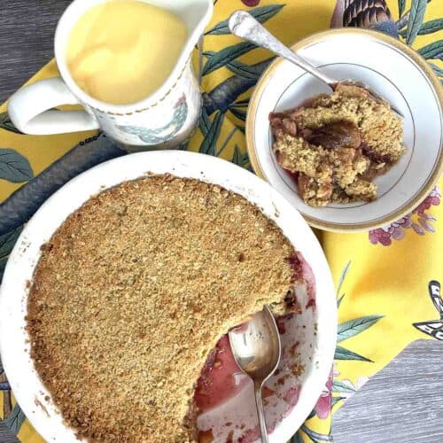 apple and fig crumble with a portion in a bowl.