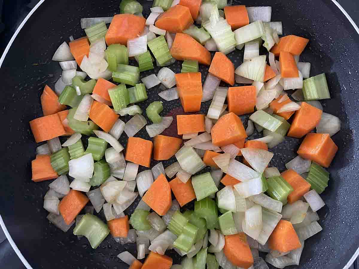vegetables frying in a pan.