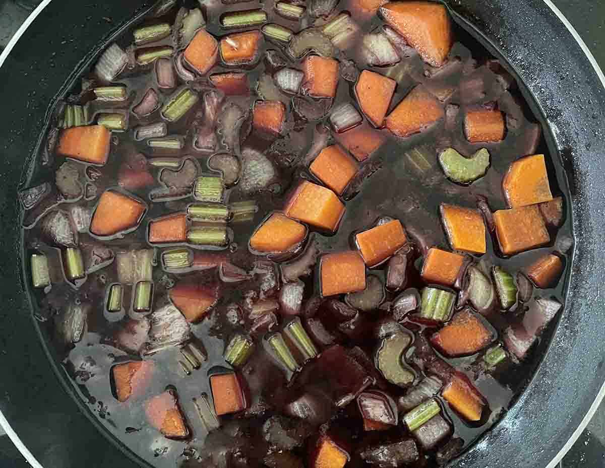stock and wine added to vegetables.