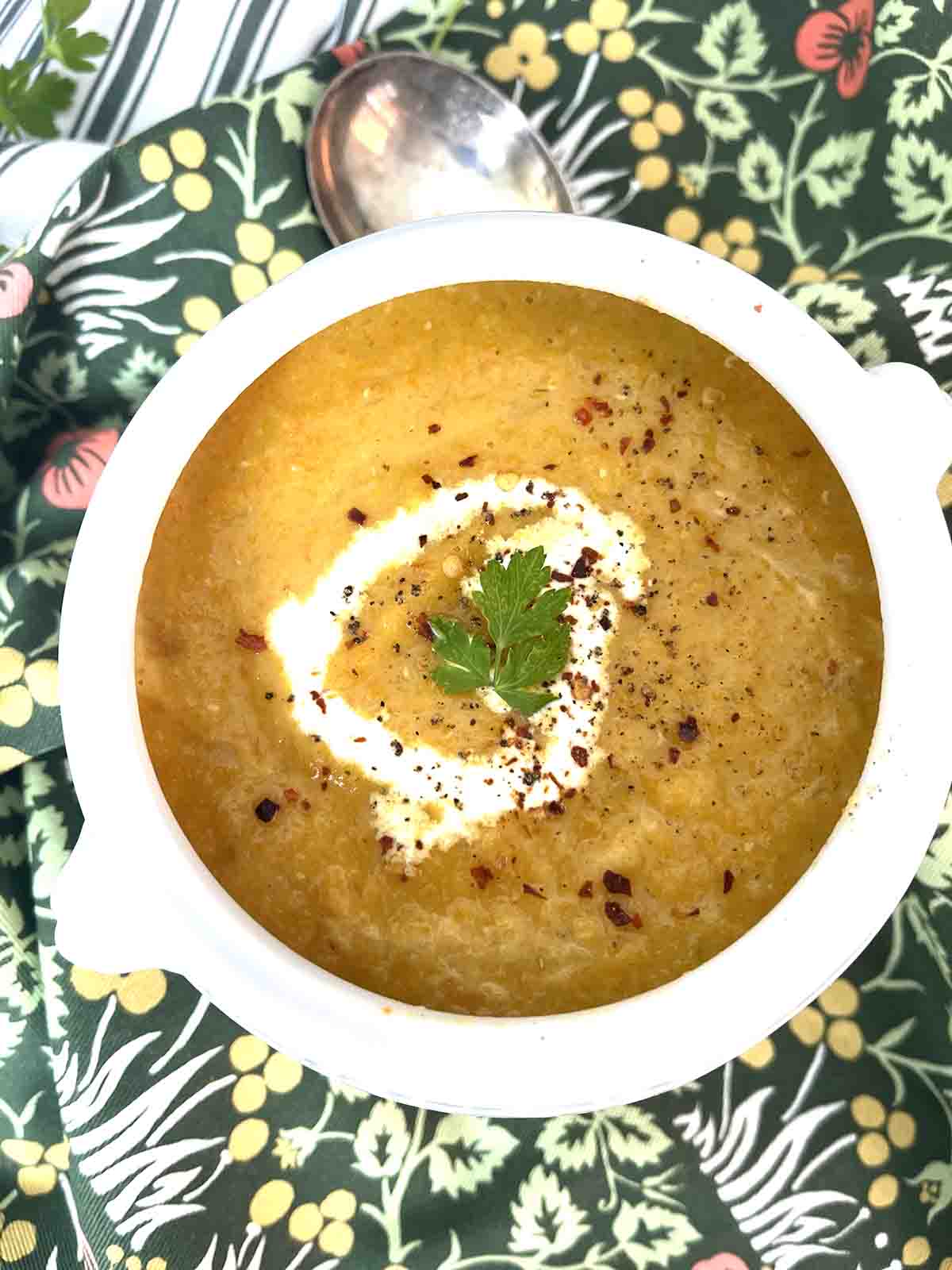 spiced carrot and lentil soup in  a bowl.