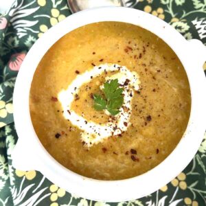 spiced carrot and lentil soup in a bowl.