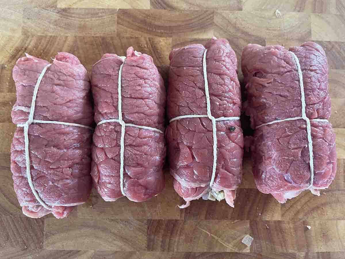 stuffed beef rolls tied up with string.