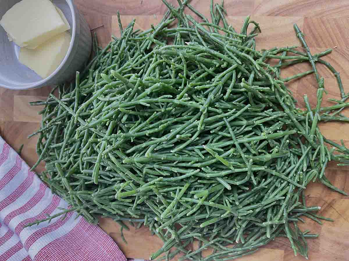 pile of samphire on a board.