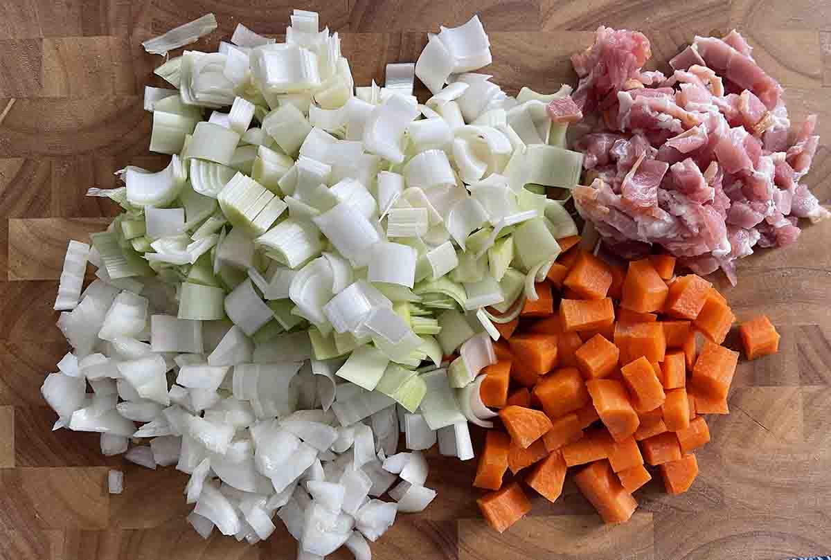 chopped leaks, onions, carrots and bacon.