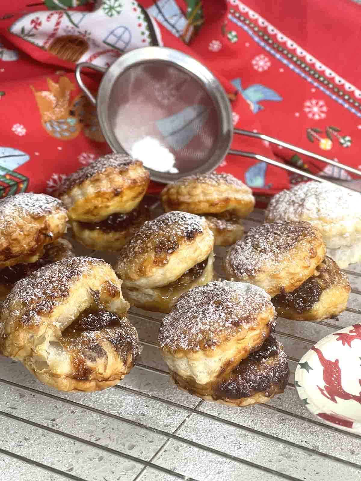 puff pastry mince pies on a cooling rack.