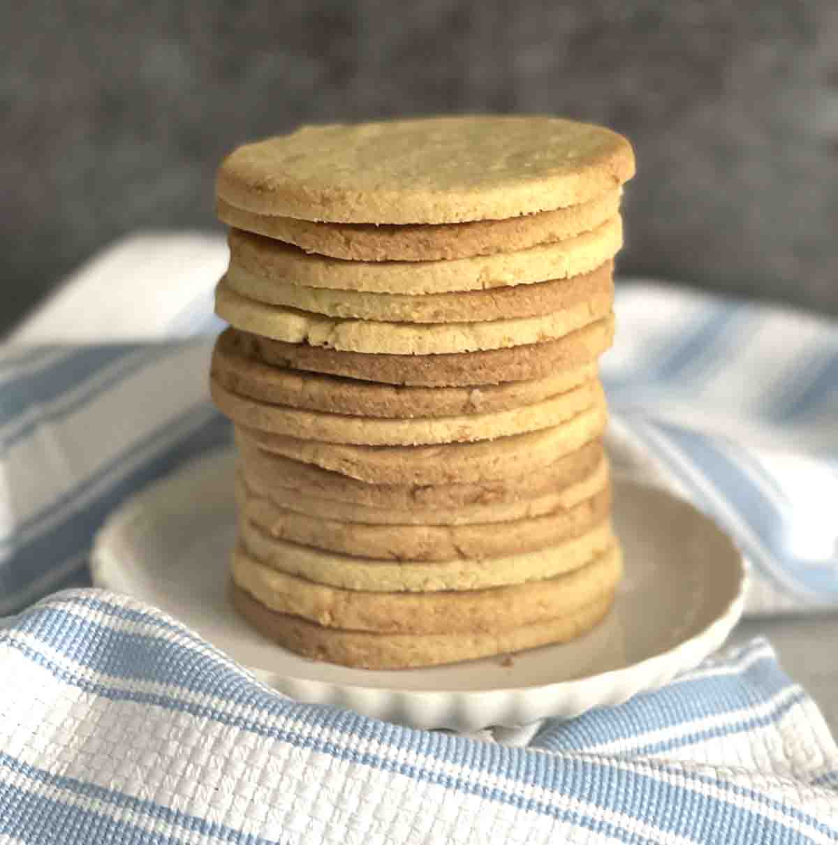 stack of shrewsbury biscuits on a plate.