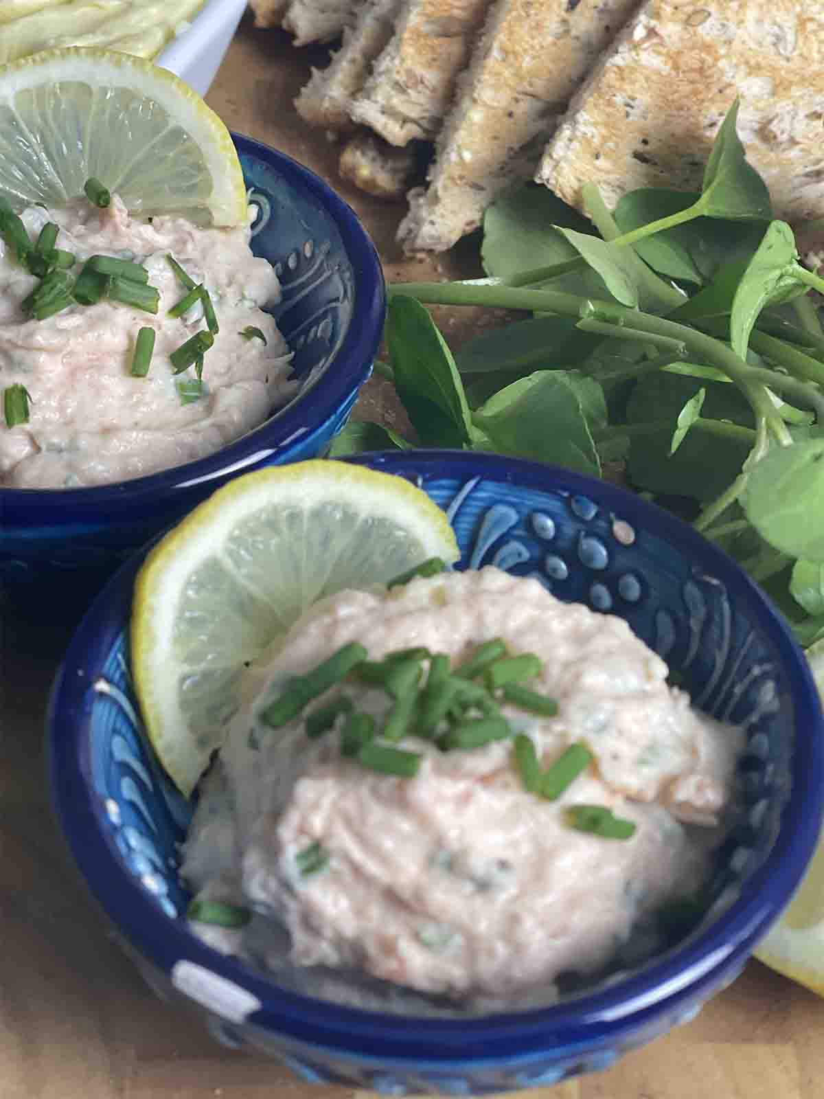 pot of  smoked salmon  pâté with watercress in the background.