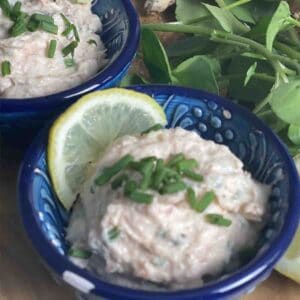 pot of smoked salmon pate with watercress in the background.