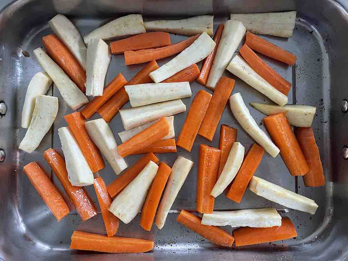 cut vegetables in a roasting tray.