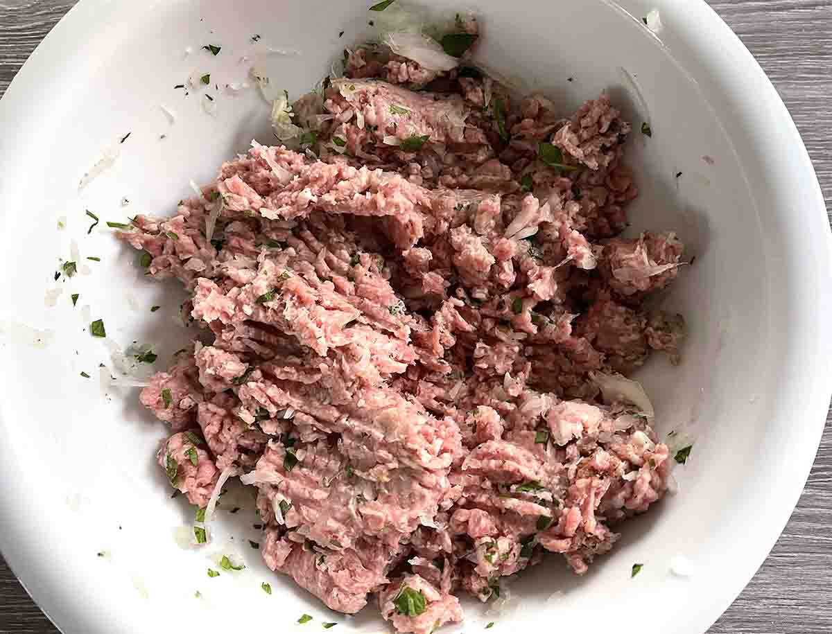 lamb mince in a white bowl.