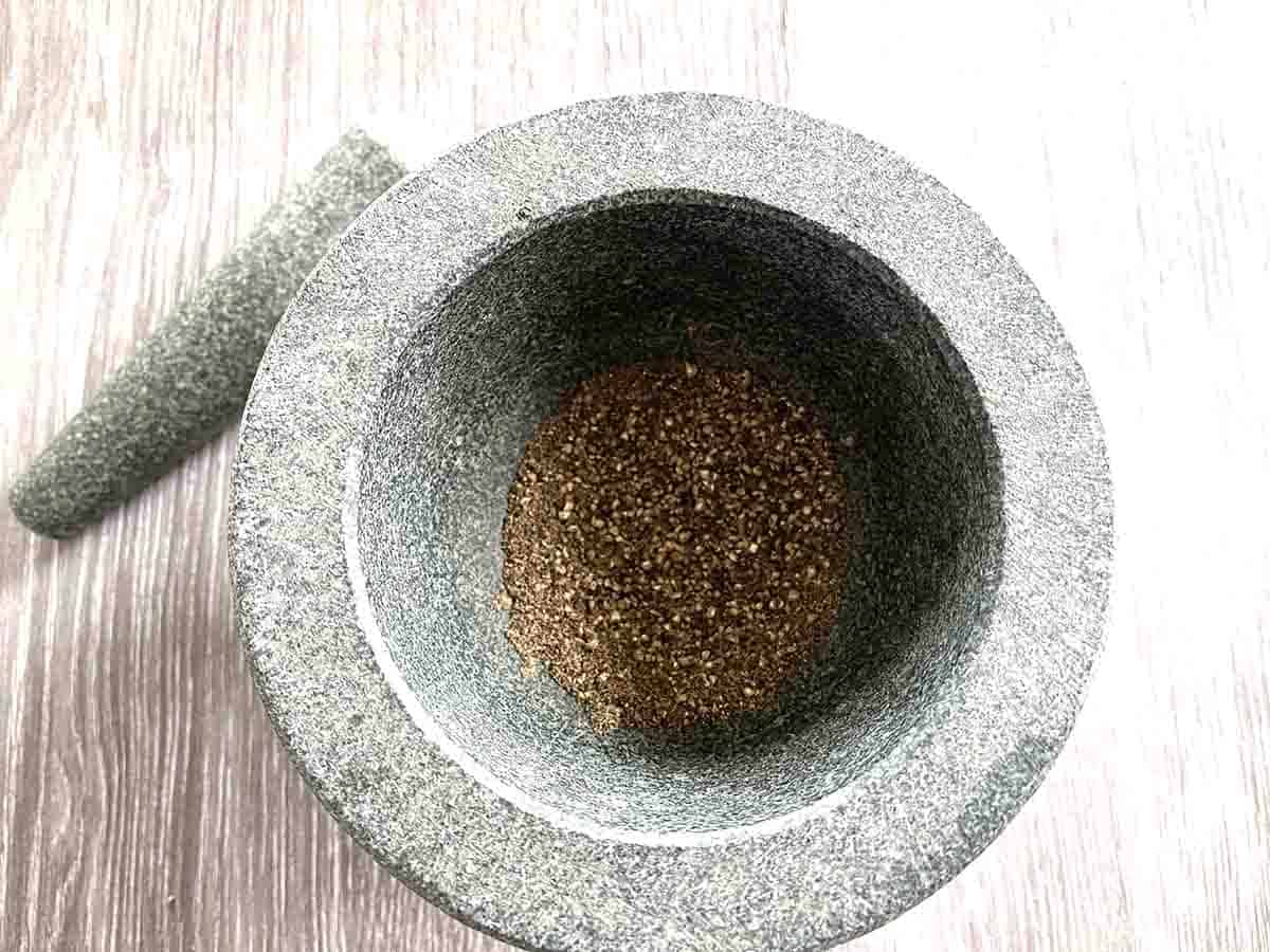 ground peppercrons in a pestle and mortar.