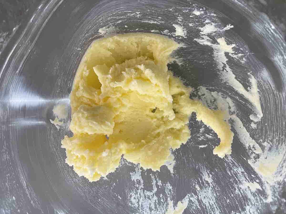 sugar and butter creamed in a bowl.