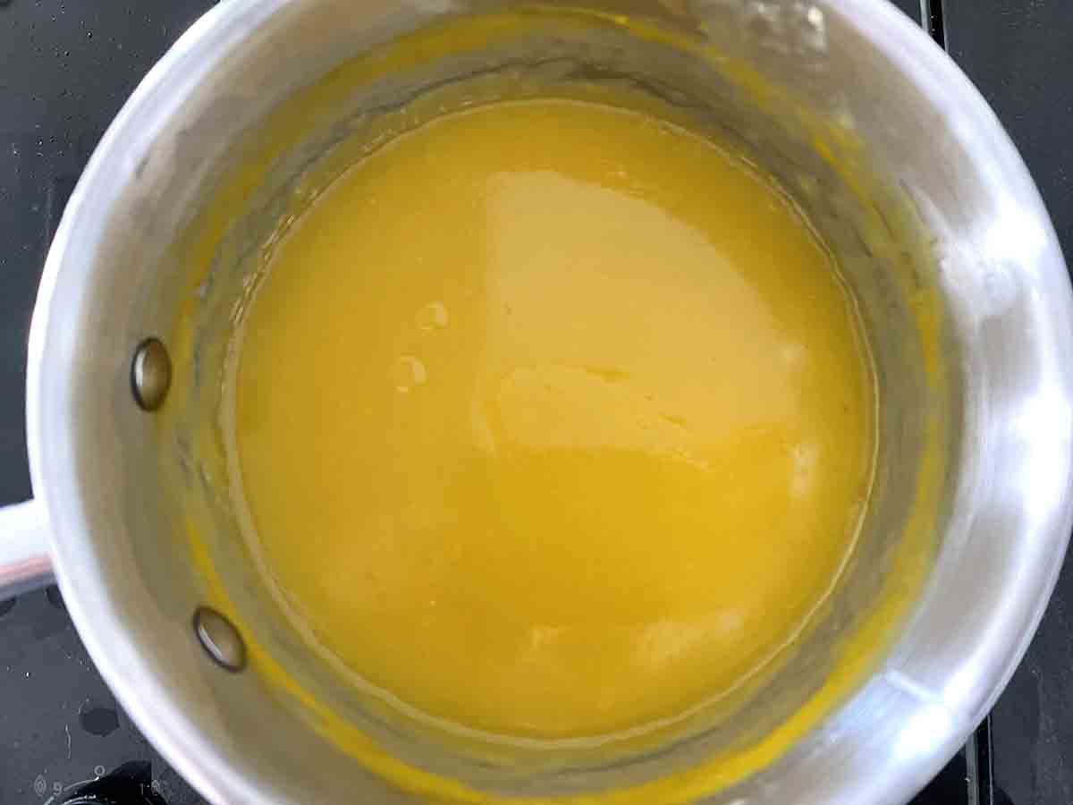 orange custard mixture in a pan.