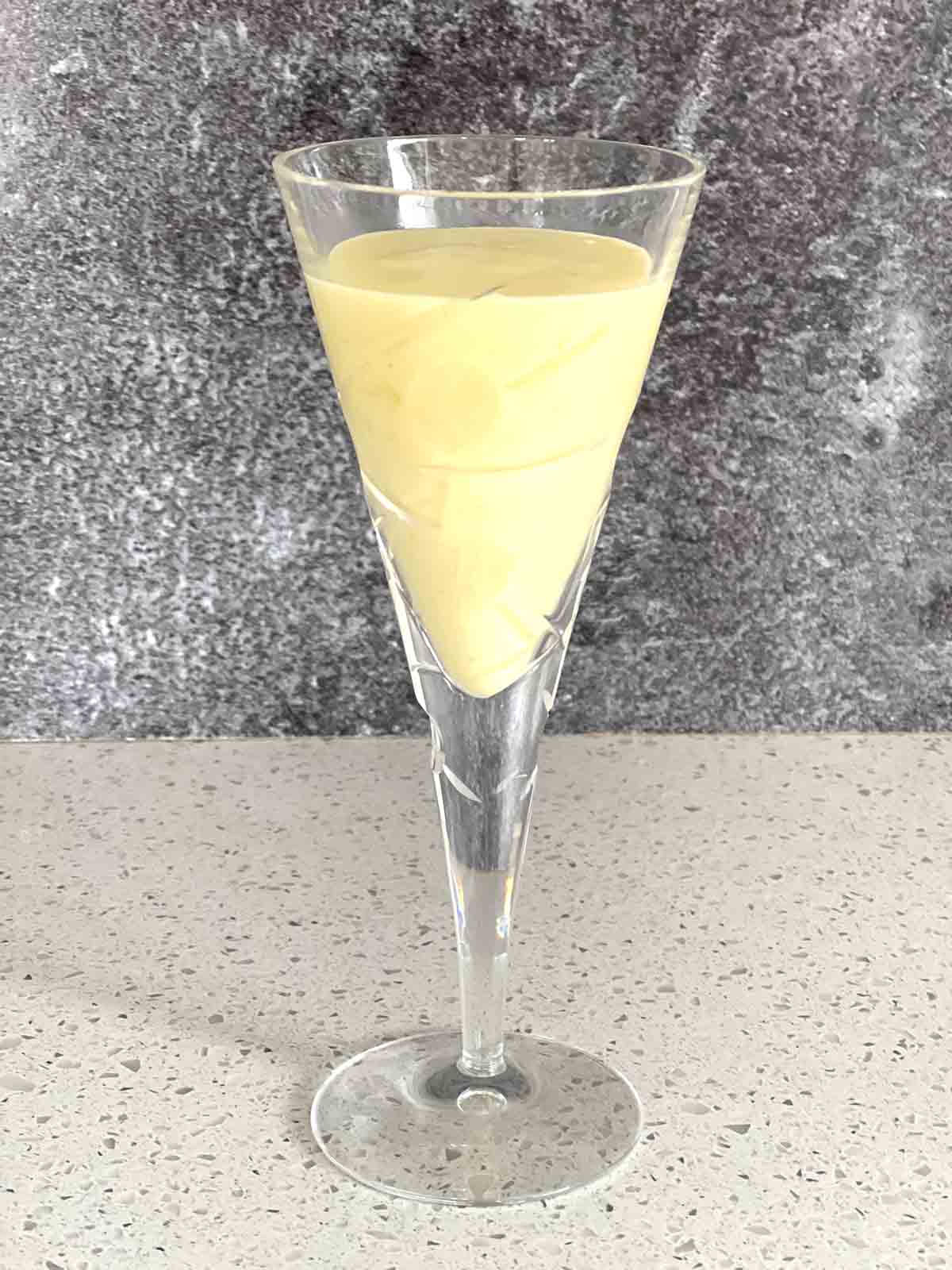 custard mixed with cream in a glass.