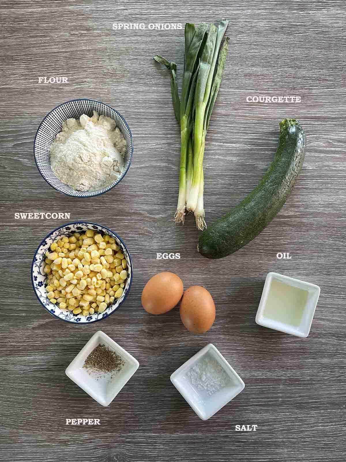 ingredients including courgettes, sweetcorn, spring onions, eggs, flour and seasoning.