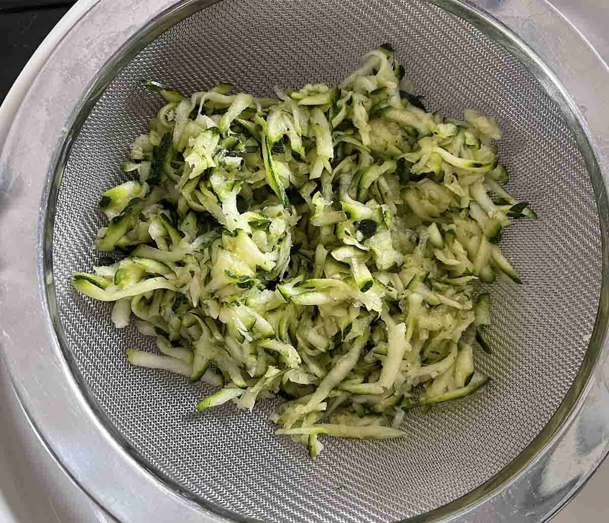 grated courgette in a bowl.