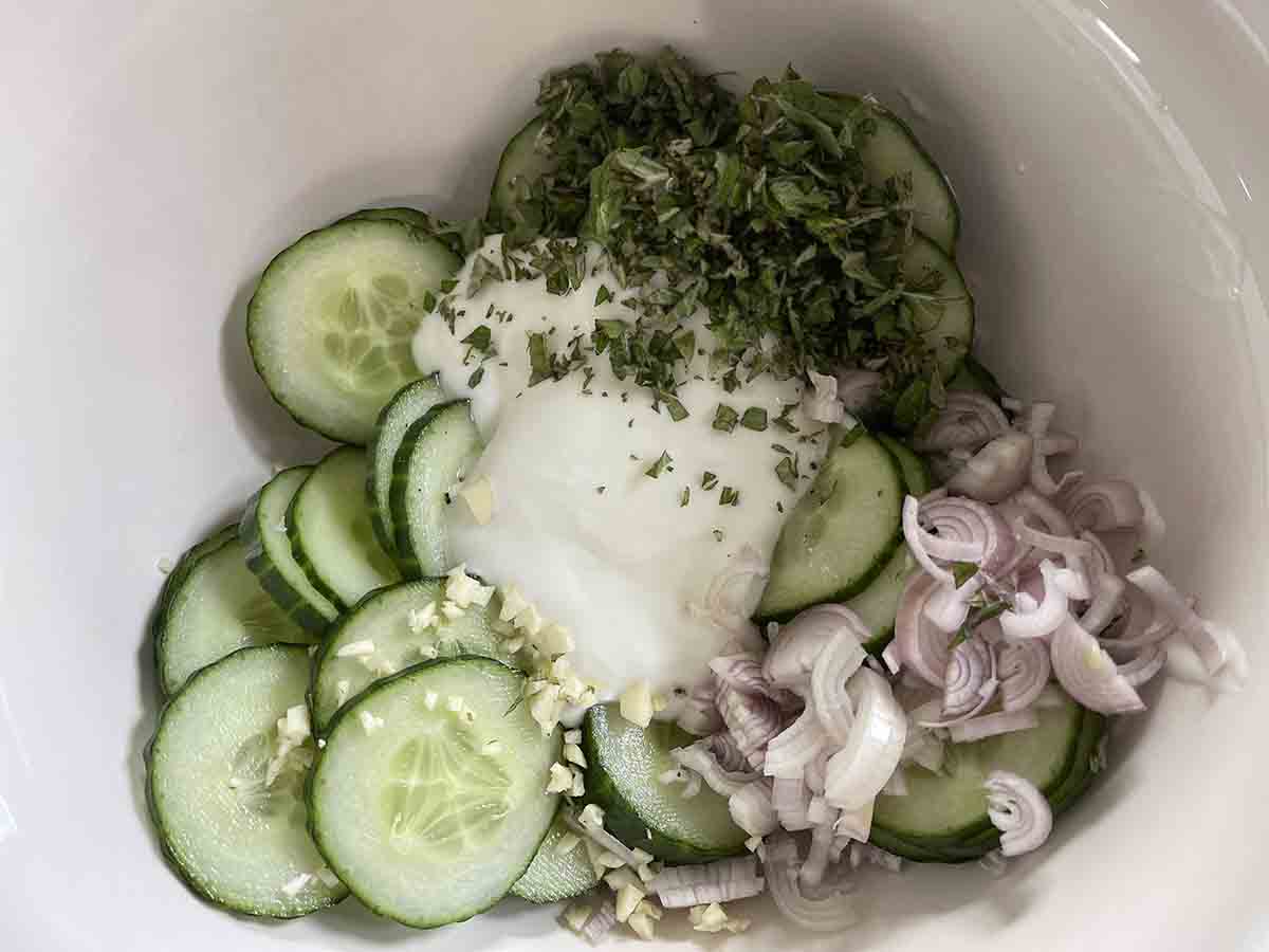 cucumber, and other ingredients in a bowl.