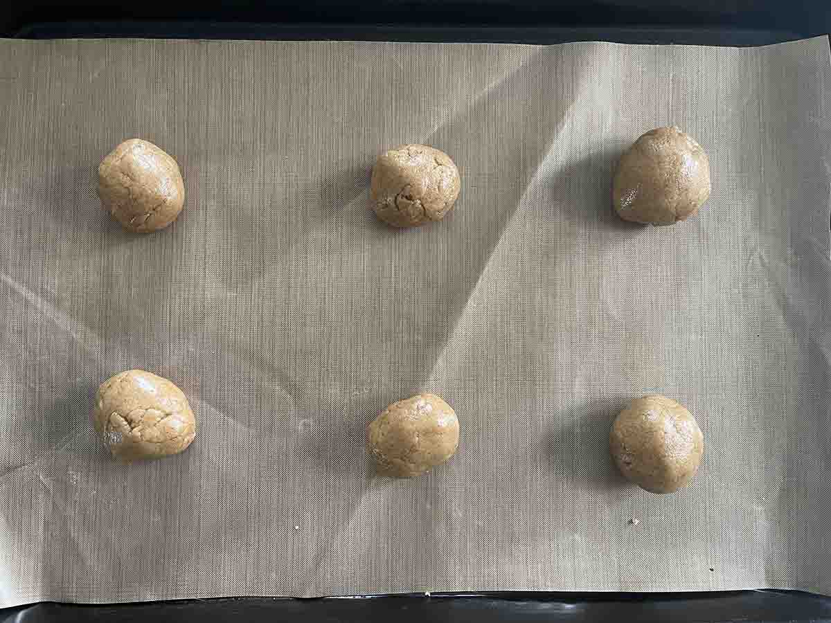 balls of dough on a tray.