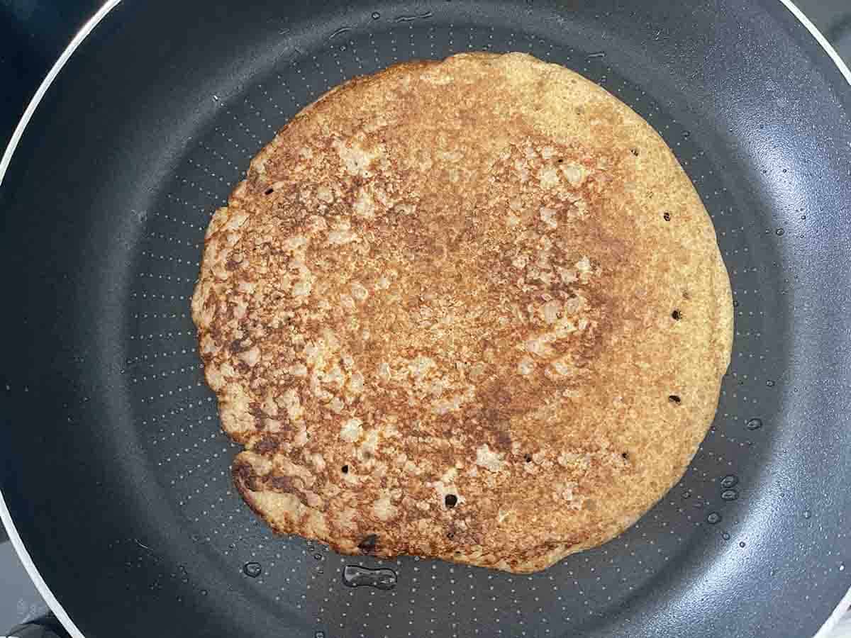 flipped oatcake in a pan.
