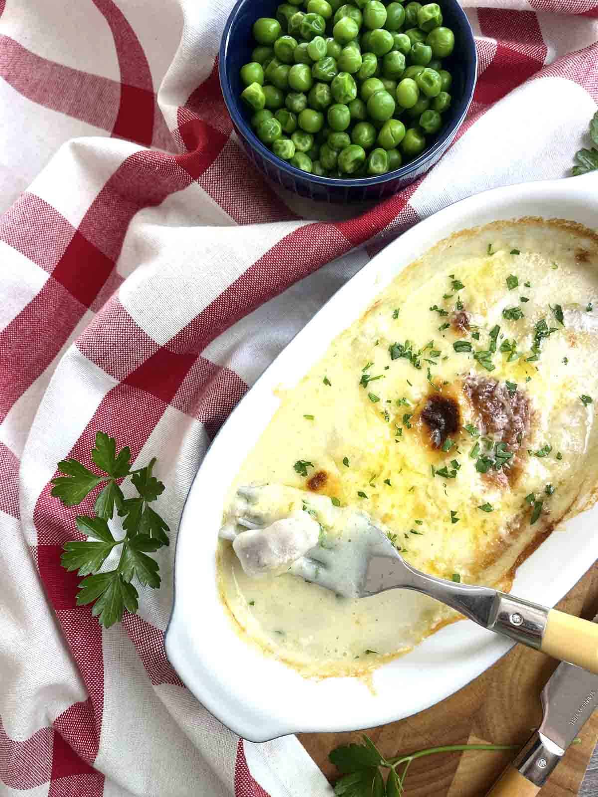 fish bake with fork in dish.