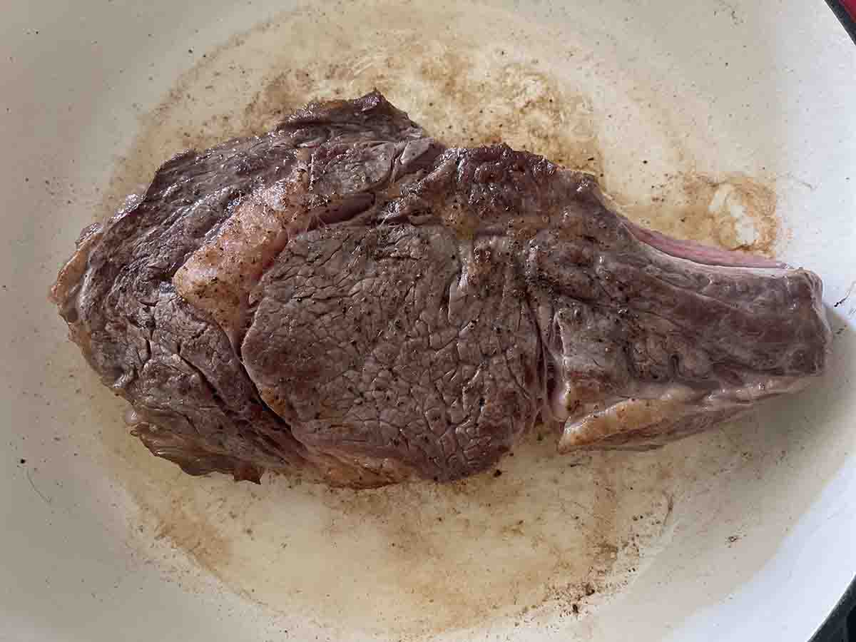 steak seared in a pan.