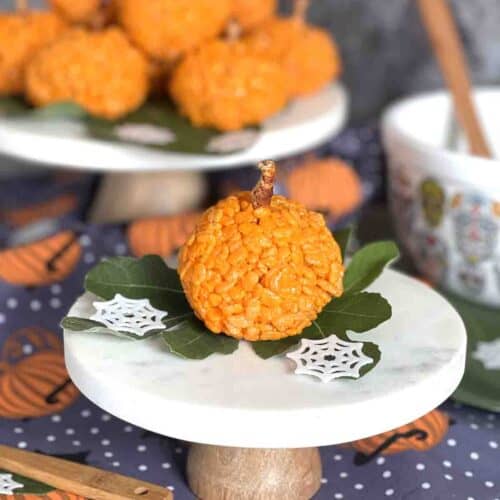 pumpkin rice krispie treats on a plate.