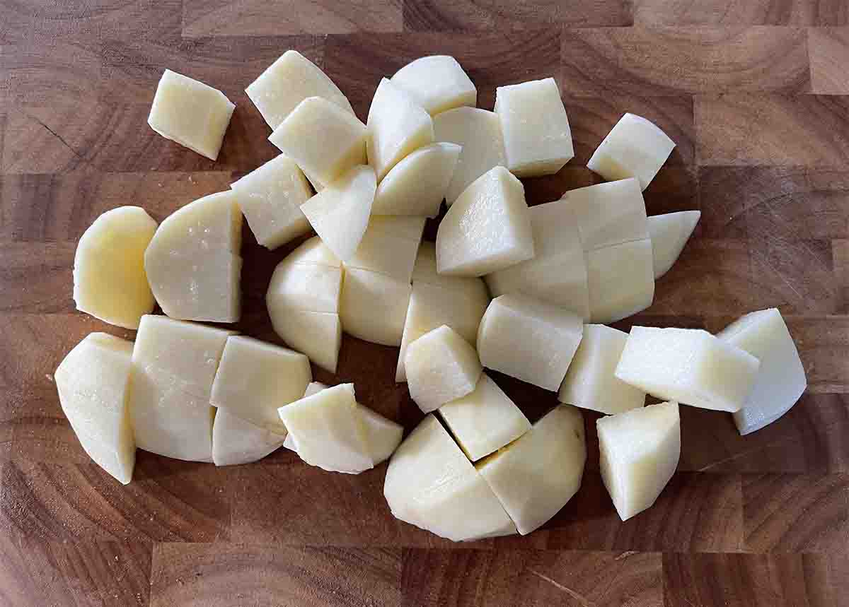 chopped potatoes on a board.