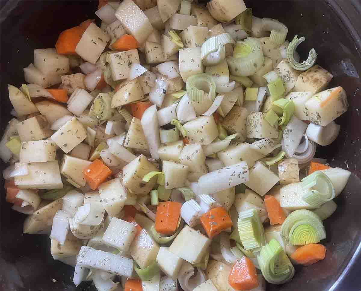 vegetables in slow cooker pot.