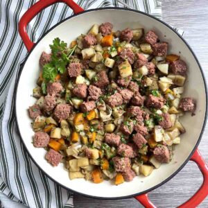 slow cooker corned beef hash in a dish.