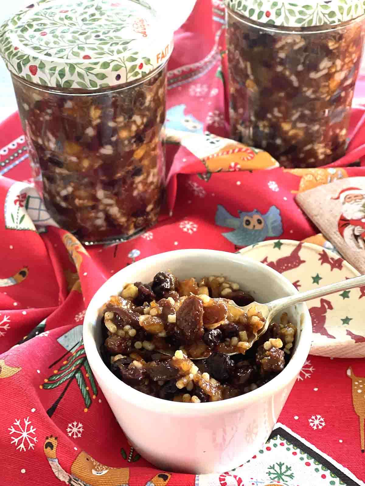 mincemeat in a pot with jars.