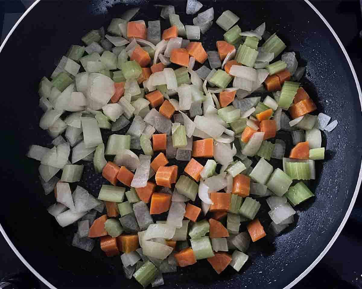 softened vegetables in a pan.