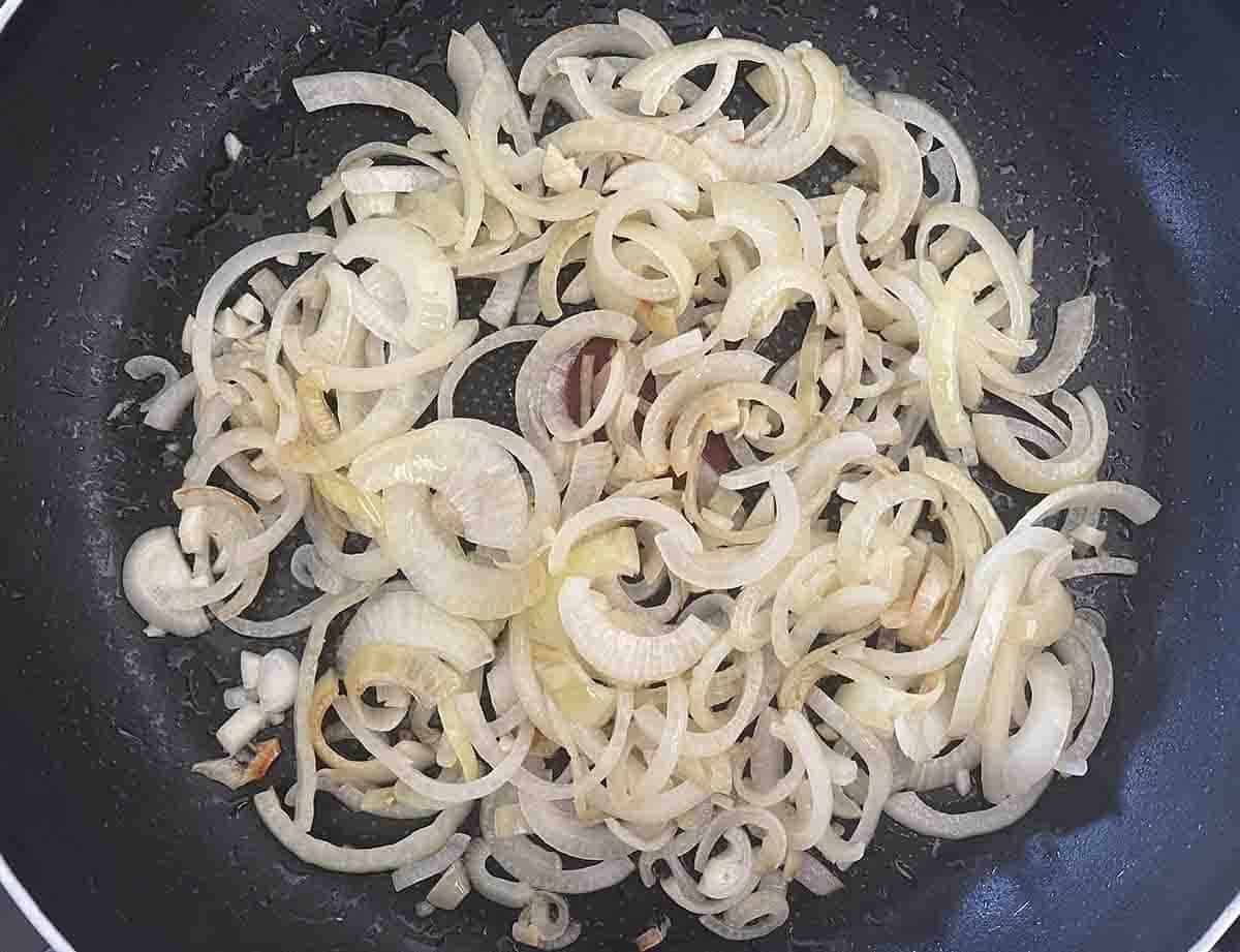 onions cooking in a pan.