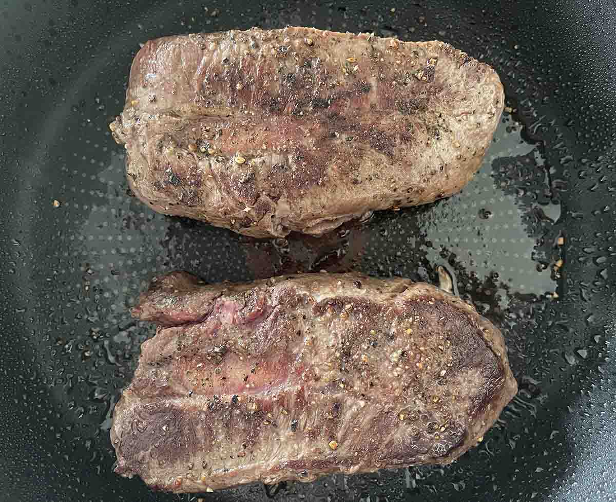 seared steaks in the pan.