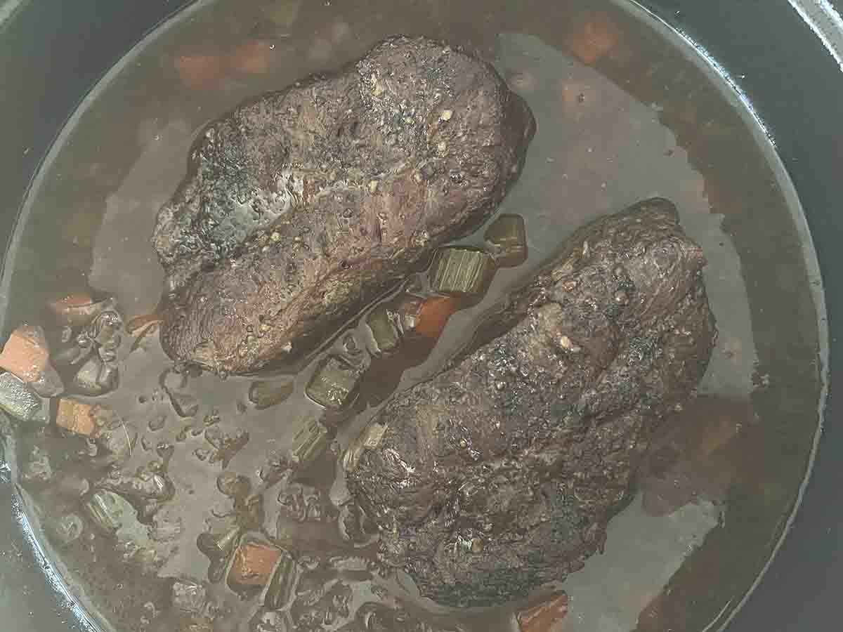 cooked steak and gravy.