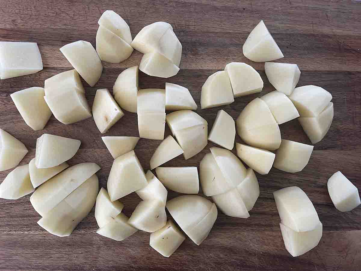 cut potatoes on a board.