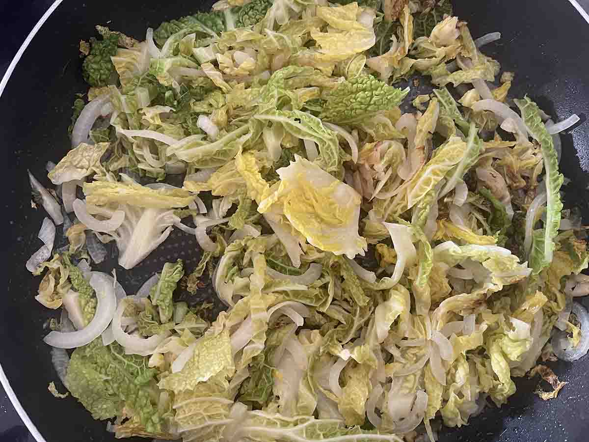 cabbage cooking in a pan.