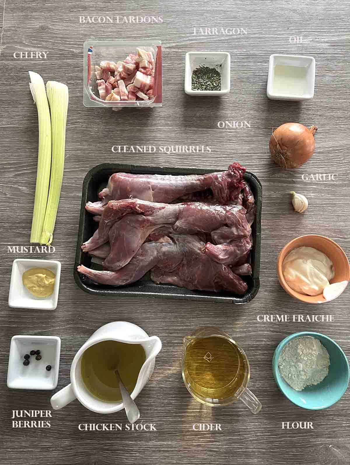 ingredients for the recipe in bowls including squirrel, celery and stock.