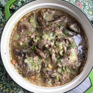 braised squirrel in cider in a dish.