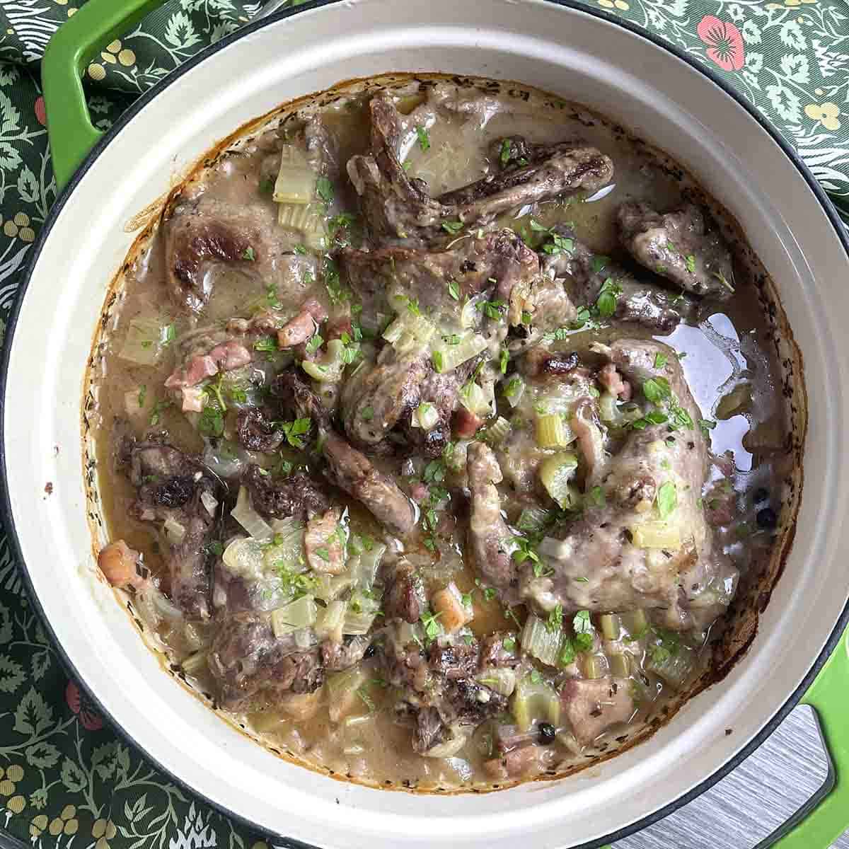 braised squirrel in cider in a dish.