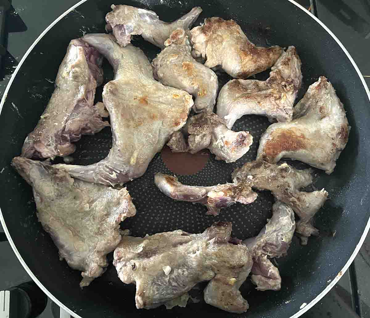 portions browning in a pan.