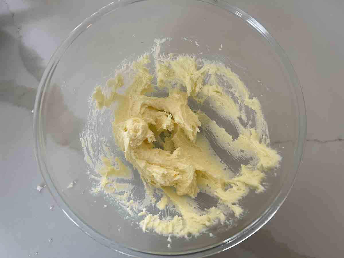 sugar and butter creamed in a bowl.