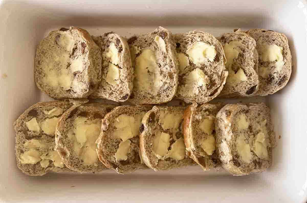 buttered buns in a dish.