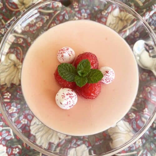 raspberry posset in a glass.