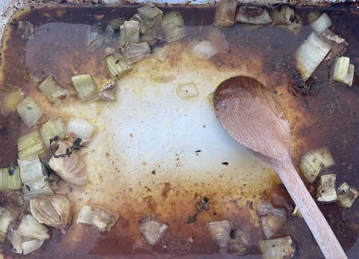 wine added to roasting pan.